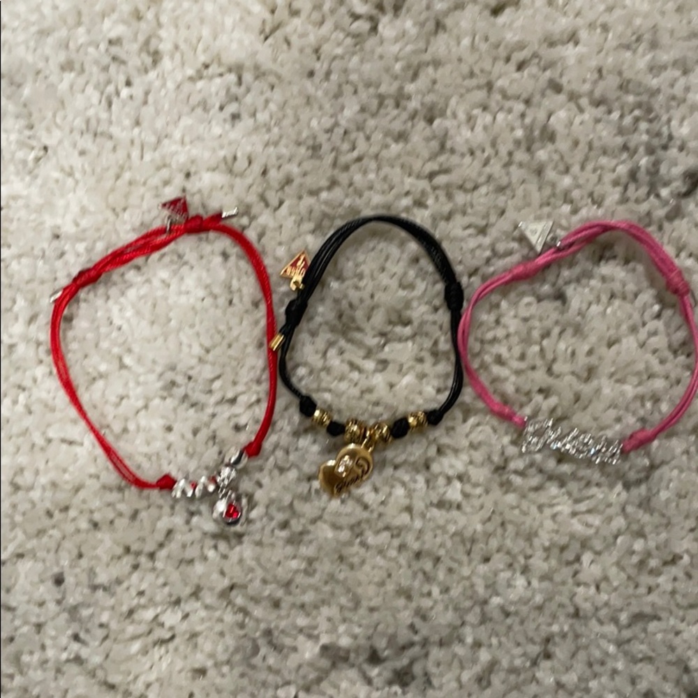 4 Guess bracelets